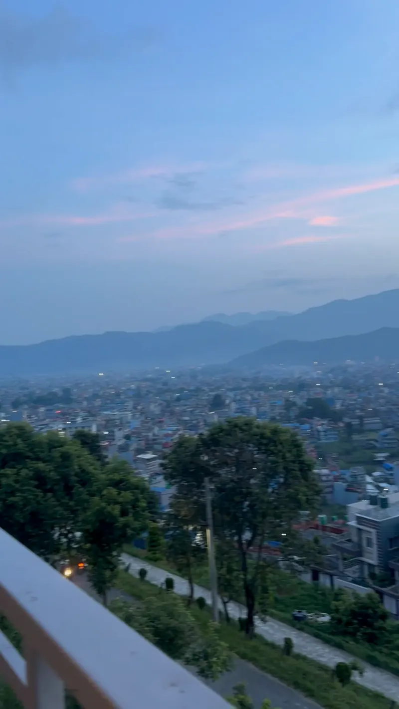 Pokhara valley at blue hour from The Lookout, the first lights coming on